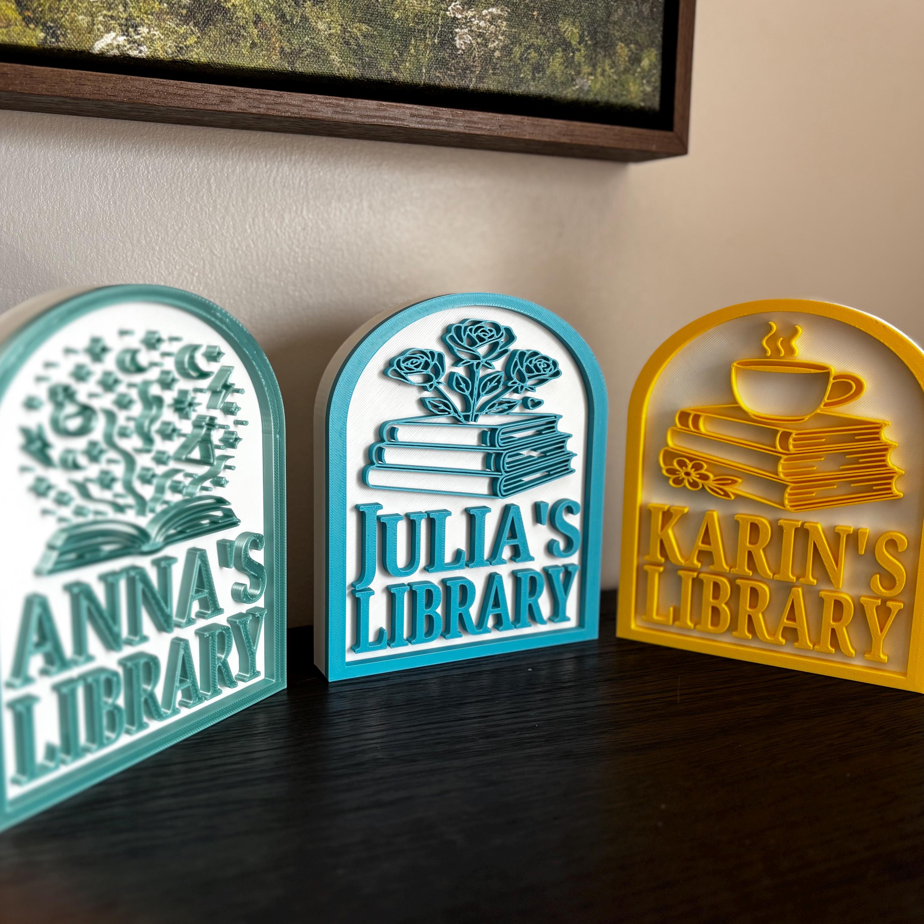 Custom bookshelf signs for personal library, featuring books, flowers, and teacup designs.