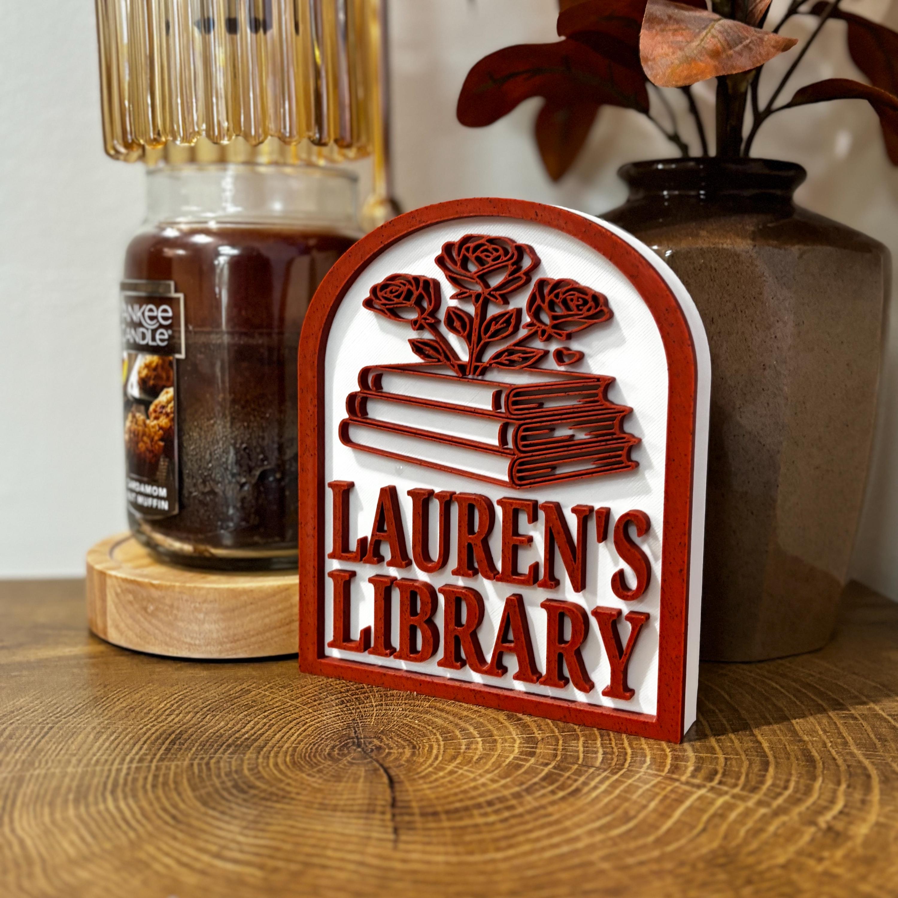 Personalized library sign with stacked books and roses, custom bookshelf decor on wooden table