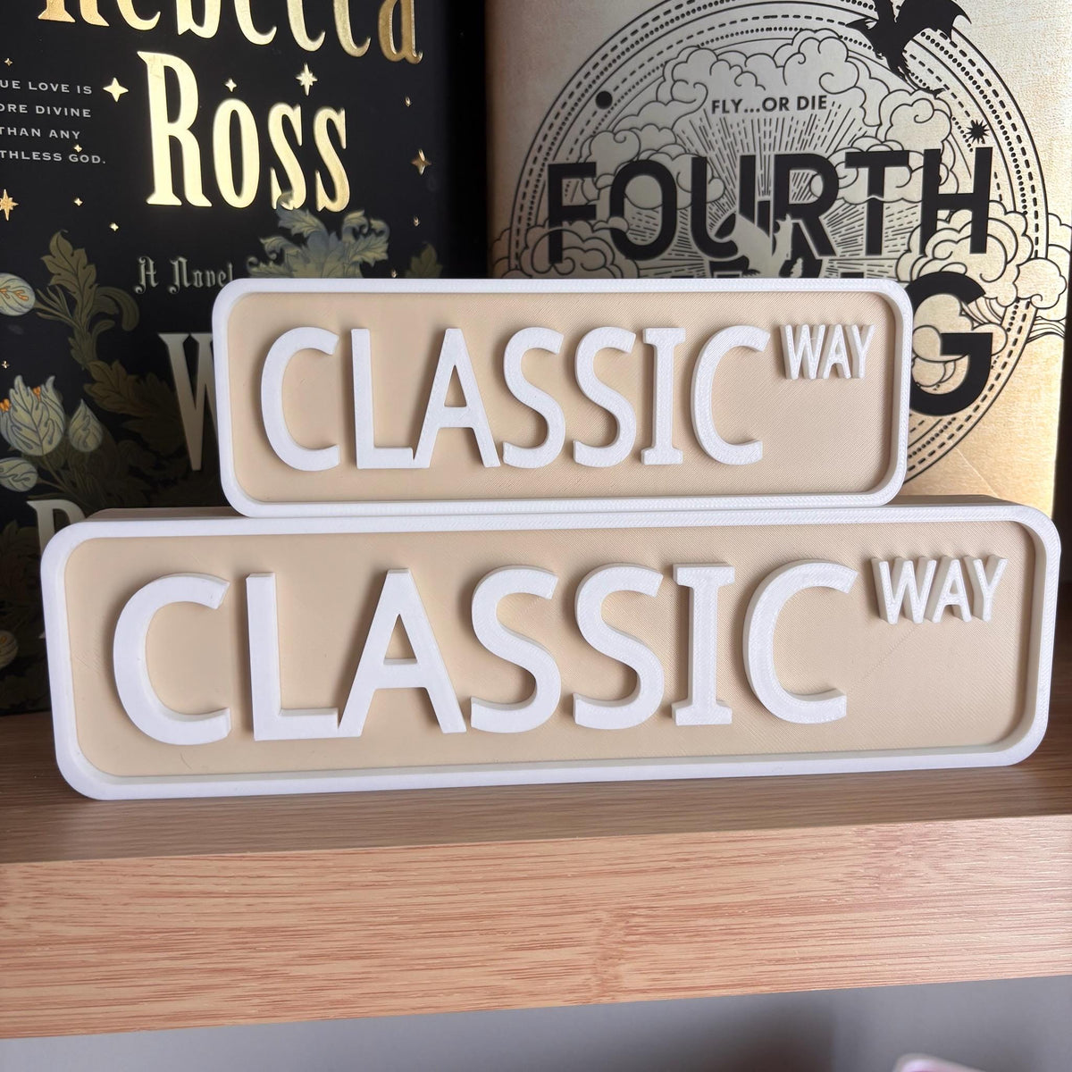 Front view of the small and large beige and white CLASSIC WAY street signs