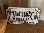 White and black Thriller Book Club ticket with handprint and knife details